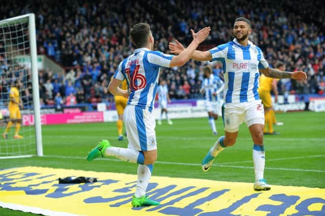 Huddersfield's Jack Payne celebrates making it 2-1 with Nahki Wells. Picture: Jonathan Gawthorpe
