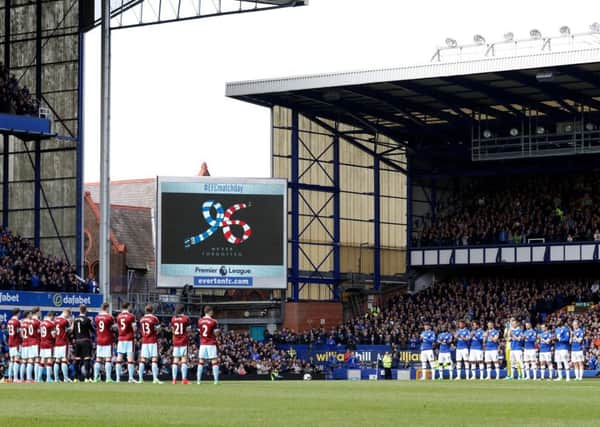Everton and Burnley players observe a minutes applause for the victims of the Hillsborough Disaster during the Premier League match at Goodison Park, Liverpool.