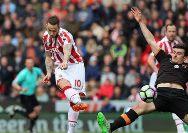 Stoke City's Marko Arnautovic scores his side's first goal against Hull City. Picture: Barrington Coombs/PA