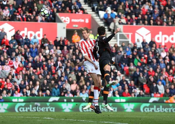 Stoke City's Peter Crouch scores his side's second goal against Hull City. Picture: Barrington Coombs/PA