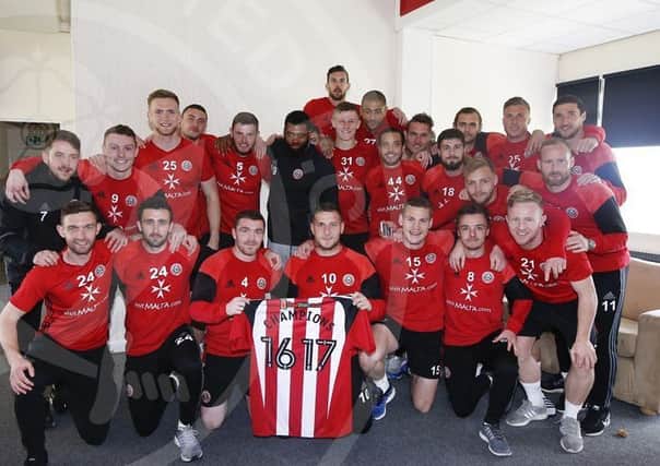Sheffield United's players celebrate becoming champions at their training ground on Saturday. Picture courtesy of Sheffield United