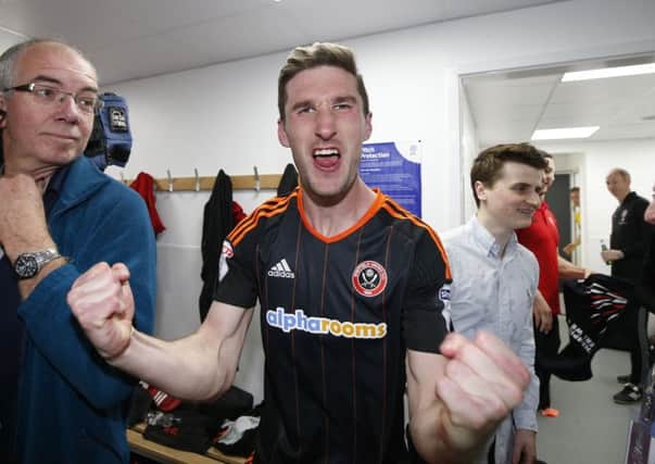 Chris Basham celebrates promotion at Northampton last week. Picture: Simon Bellis/Sportimage