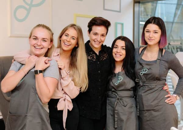 Pastille Founders Abra Wynn (second from left) and Erene Hadjiioannou (middle) celebrate the salon relaunch with their team. Photo: Joanne Crawford Photography