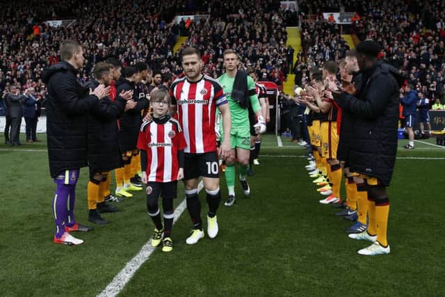 Billy Sharp leads out Sheffield United to a guard of honour formed by Bradford during the English League One match at Bramall Lane (Picture: Simon Bellis/Sportimage)