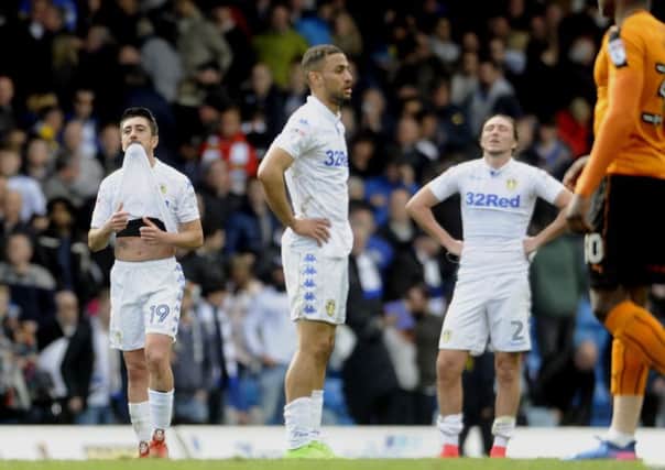 Pablo Hernandez, left, Kemar Roofe, centre, and Luke Ayling display their dismay at the final whistle against Wolves (Picture: Simon Hulme).