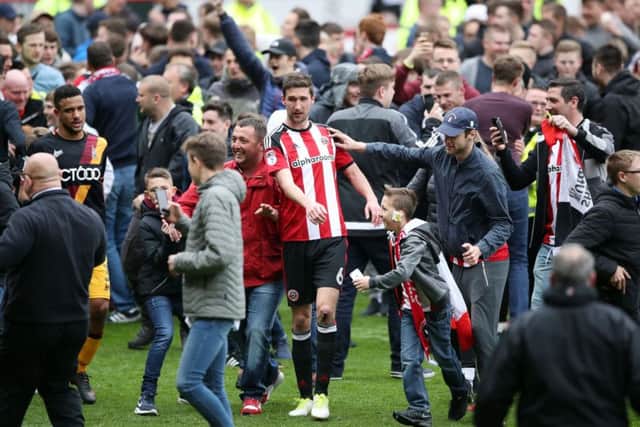Sheffield United's Chris Basham during the pitch invasion at Bramall Lane. Picture: Nick Potts/PA
