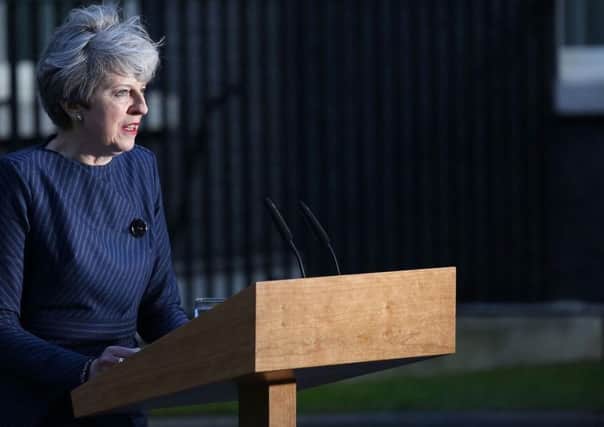 Theresa May, pictured announcing a snap election for June 8.