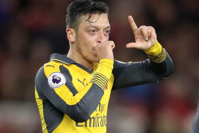Arsenal's Mesut Ozil celebrates scoring his side's second goal of the game during the Premier League match at the Riverside Stadium, Middlesbrough. (Picture: Owen Humphreys/PA Wire)