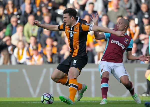 Hull City's Harry Maguire gets the better of West Ham United's Sofiane Feghouli (Picture: Richard Sellers/PA Wire).