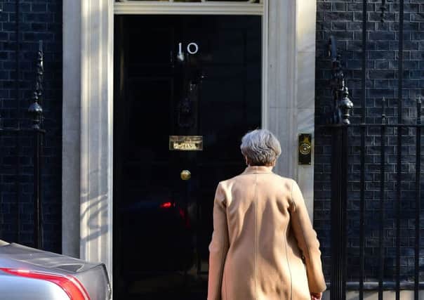 Prime Minister Theresa May arrives at 10 Downing Street in London, after she said a snap general election is necessary to prevent opposition parties at Westminster "frustrating" the Brexit process. PIC: PA