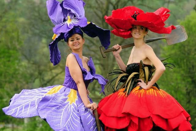 Lauren Green (left) from Leeds and Abigail Moore from Sheffield wear floral costumes by New Zealand artist Jenny Gillies. Picture by Simon Hulme