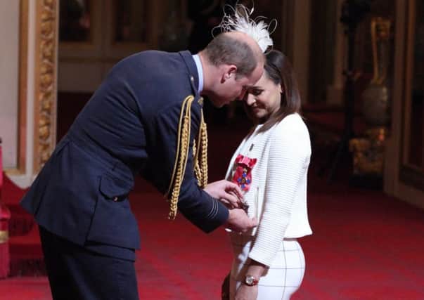 Heptathlete Jessica Ennis-Hill is made a Dame Commander by the Duke of Cambridge during an investiture ceremony at Buckingham Palace