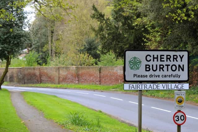 The Fairtrade Village sign at the entrance to Cherry Burton.