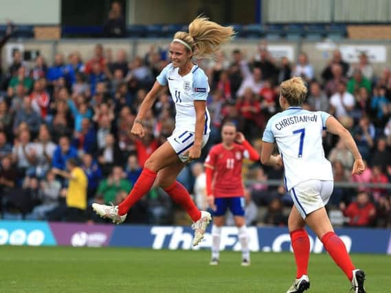 Rachel Daly celebrates scoring for England on her international debut in 2016