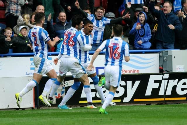 Huddersfield's Collin Quaner celebrates his late winner.
 (Picture: Jonathan Gawthorpe)