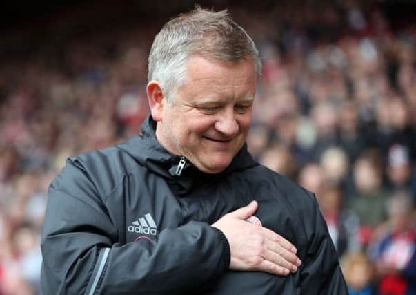 Sheffield United manager Chris Wilder pats the Sheffield United badge before the Sky Bet League One match at Bramall Lane, Sheffield. (Picture: Nick Potts/PA Wire)