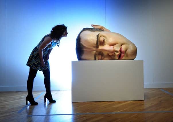 Hannah Scorer looks at  Mask 11 by Ron Mueck at the Ferens Art Gallery. Credit: Simon Hulme