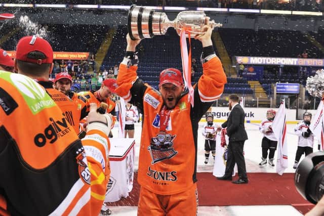 SWEET FEELING: Jonathan Phillips lifts the Elite League Play-off trophy. Picture: Dean Woolley.