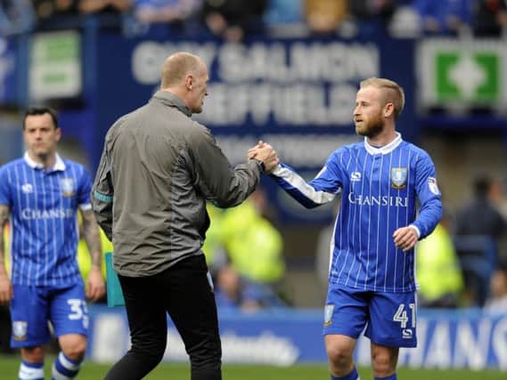 Lee Bullen shakes hands with Barry Bannan after Wednesday's 2-1 win over Derby County (Photo: Steve Ellis)