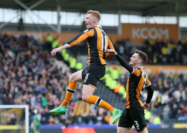 Hull City's Sam Clucas (left) celebrates scoring his side's second goal against Watofrd on Saturday.