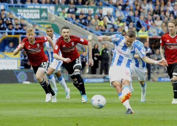 Chris Lowes early successful penalty kick was the one bright spot for Huddersfield Town as they lost 4-1 at home to Fulham (Picture: Simon Hulme).