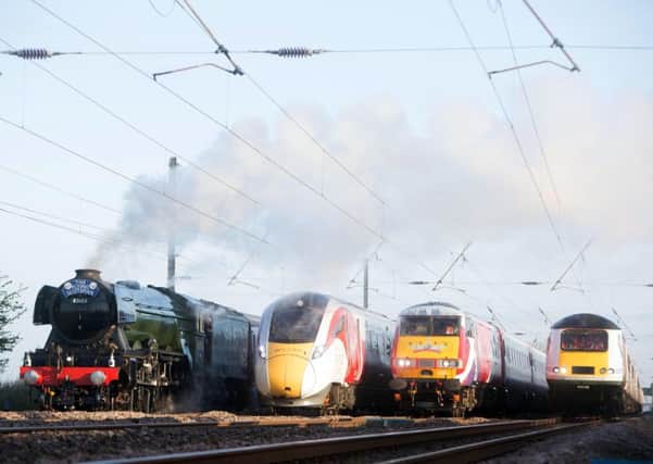 (L-R) Flying Scotsman and Virgin Trains' new Azuma travel in the same direction alongside two of Virgin Trains' present day fleet - to depict the past, present and future of UK rail travel.  Picture by David Parry/PA Wire