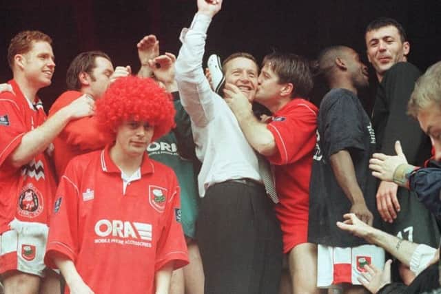 Barnsley manager Danny Wilson celebrates with his team after their promotion to the Premiership in 1997. Picture: Paul Barker/PA
