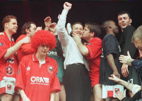 Barnsley manager Danny Wilson celebrates with his team after their promotion to the Premiership in 1997. Picture: Paul Barker/PA