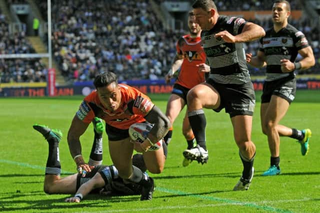 OVER THE LINE: Castleford's Ben Roberts gets away from Hull's Steve Michaels to score. 
Picture: Jonathan Gawthorpe