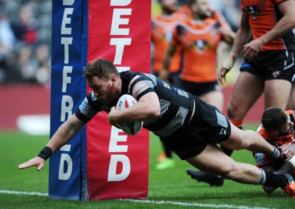 OPENING SALVO: Hull's Scott Taylor gets away from Castleford's Zak Hardaker to score the opening try. Picture: Jonathan Gawthorpe