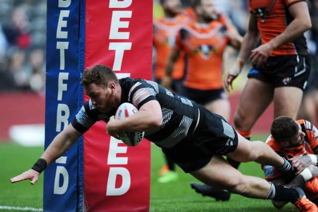 Hull's Scott Taylor gets away from Castleford's Zak Hardaker to score the opening try.