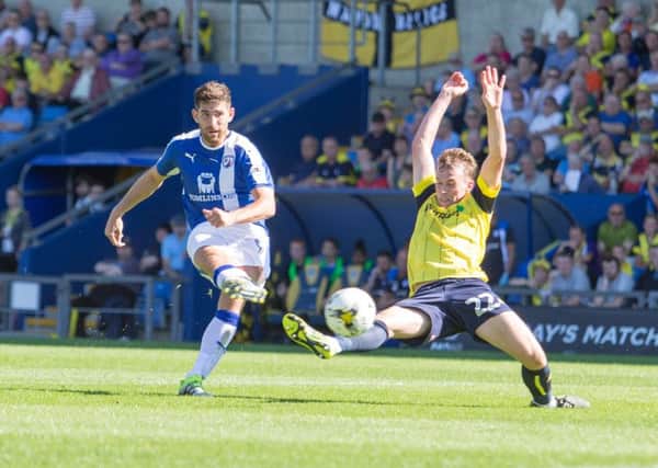Oxford United vs Chesterfield - Ched Evans gets a shot on target but its beaten away by Oxford United goalkeeper Simon Eastwood - Pic By James Williamson