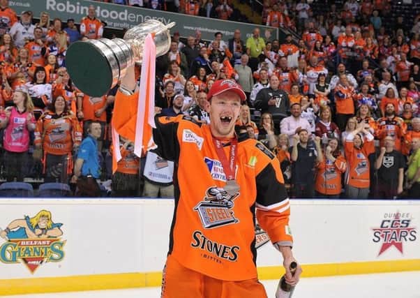 Sheffield Steelers' Davey Phillips celebrates with the Elite League play off trophy earlier this month. Picture: Dean Woolley.