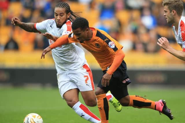 Wolverhampton Wanderers' Nathan Byrne (right) and Huddersfield Town's Sean Scannell battle for the ball during the Sky Bet Championship match at Molineux on Saturday October 3, 2015