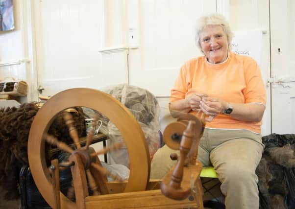 Sue Woodcock spinning wool.