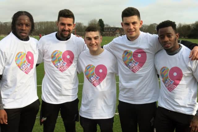 Jim (centre) with members of Brentford Football CLub suppoering his Save9Lives campaign