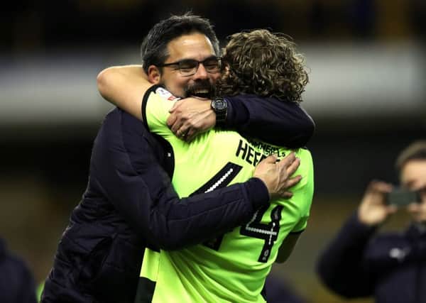 Huddersfield Towns head coach David Wagner hugs Michael Hefele after the final whistle at Molineux (Picture: Bruce Rollinson).