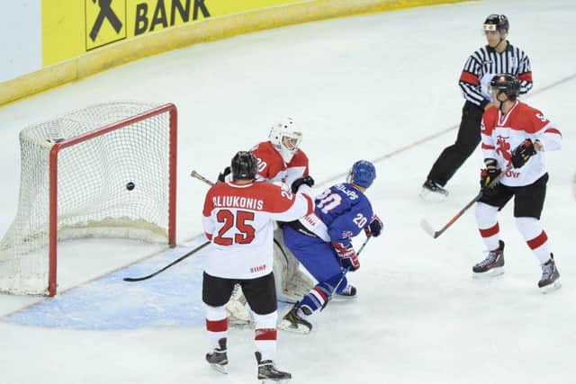 Jonathan Phillips (in blue) tips in Paul Swindlehurst's shot to make it 2-1 against Lithuania. Picture: Dean Woolley.