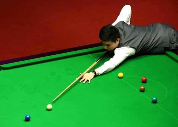 Ding Junhui during his match against Mark Selby at the Crucible in which he has a 5-3 advantage (Picture: Tim FGoode/PA).