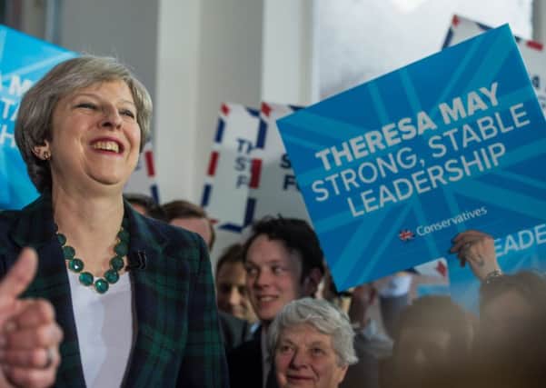 Theresa May, pictured in Leeds, was careful about promising too much. (JP).