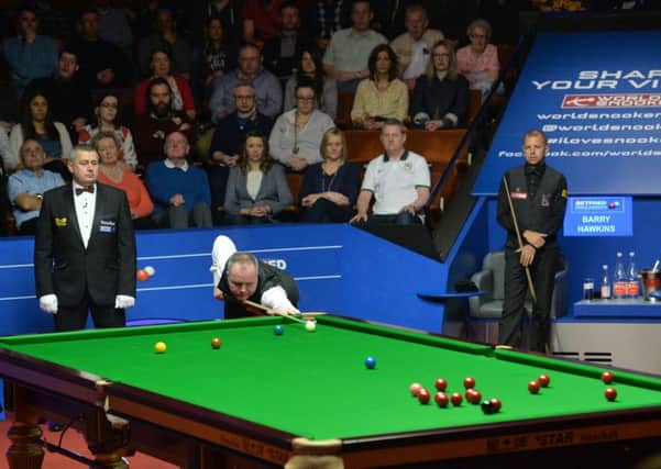 John Higgins at the table in his semi final match against Barry Hawkins.