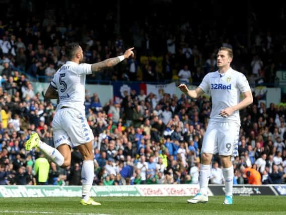 Kyle Bartley celebrates Leeds United's second goal with leading marksmen Chris Wood