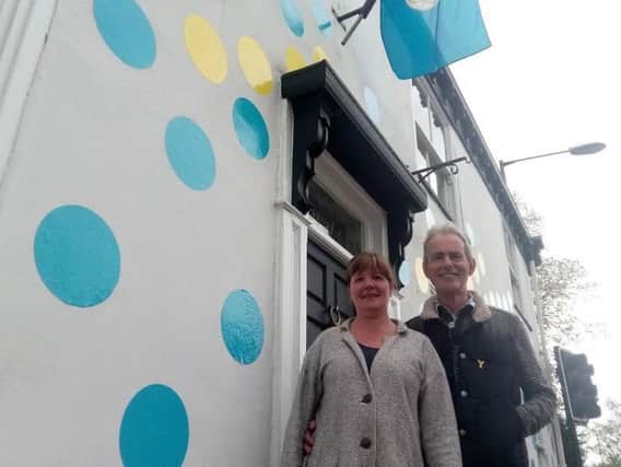 Lori and Tony Handley outside the famous spotty house!