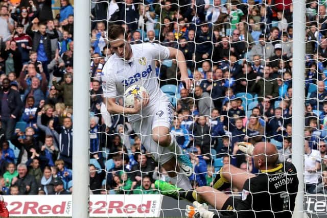 Fighting back in vain: Leeds United striker Chris Wood grabs the ball after making it 3-1 on the stroke of half-time against Norwich City (Picture: Jack Varley)