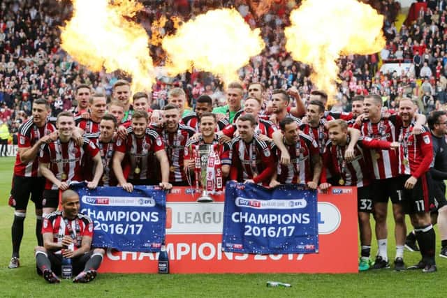 Sheffield United's players celebrate with the League One trophy (Picture: David Klein/Sportimage)