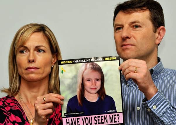 Gerry and Kate McCann in 2012 with a specially aged picture of Madeleine as she might have looked then. Picture: John Stillwell/PA Wire