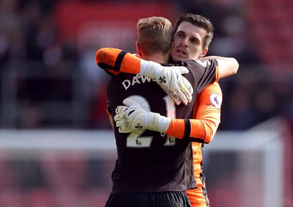 Hull City goalkeeper Eldin Jakupovic and Michael Dawson after the Premier League match at St Mary's, Southampton.