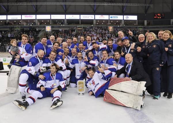 GB's players and staff celebrate their gold medal and promotion to Division 1A in belfast. Picture: Dean Woolley.