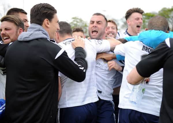 Guiseley stay up as the players celebrate (Picture: Steve Riding)