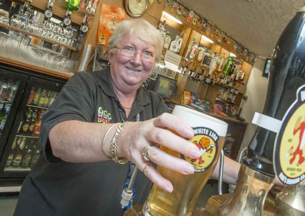 Picture by Allan McKenzie/YWNG - 31/08/15 - Press - Drighlington Beer Festival - Drighlington CC, Drighlington, England - Carol Holmes serves up pints at the beer festival.